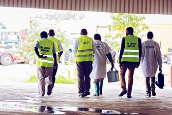 Six inspectors in high-visibility vests and overalls during a simulation exercise organised by Kenya and Tanzania.
