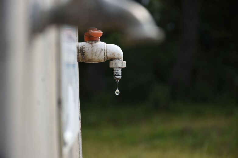 A tap drips. 