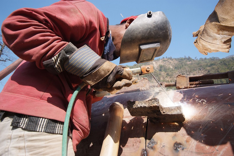 Craftspeople welding