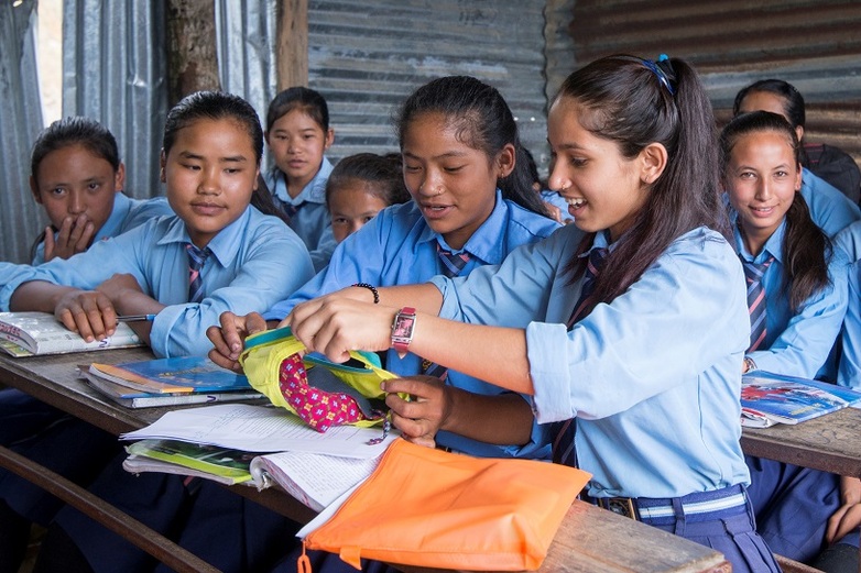 School girls in Nepal learn how to use sanitary pads.