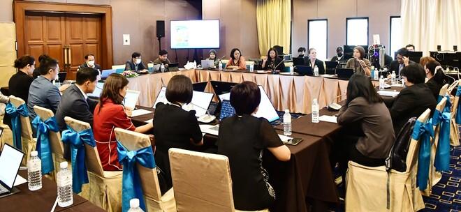 Group of people sitting at tables discussing