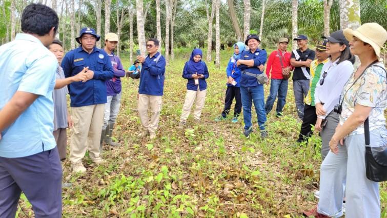 Group of people listening to a person talk