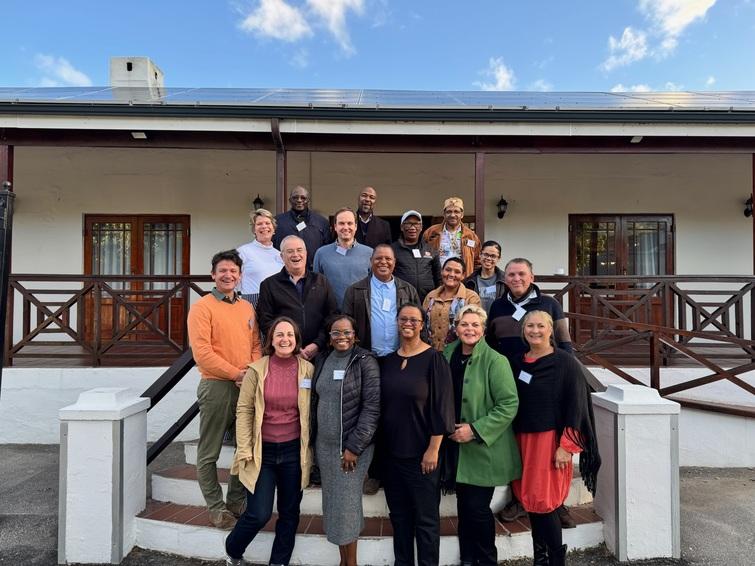 Group photo of people standing on stairs