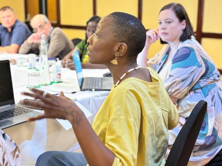 Woman speaking while people listen to her