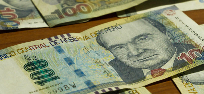 Peruvian banknotes on a table.