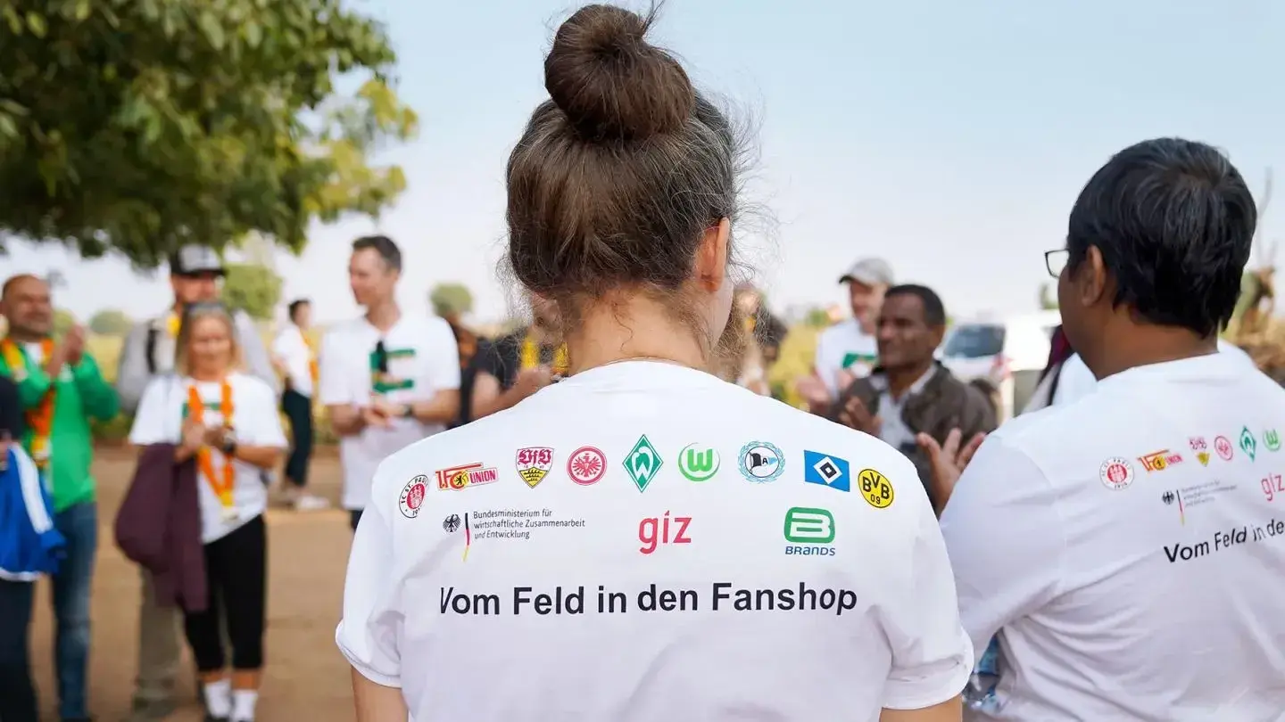 Photo of a T-shirt with logos of the clubs supporting the project