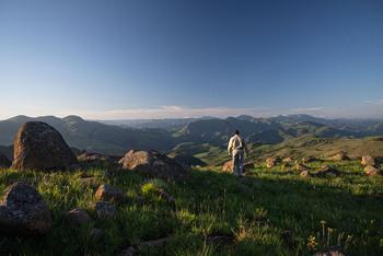 A man walks through nature.