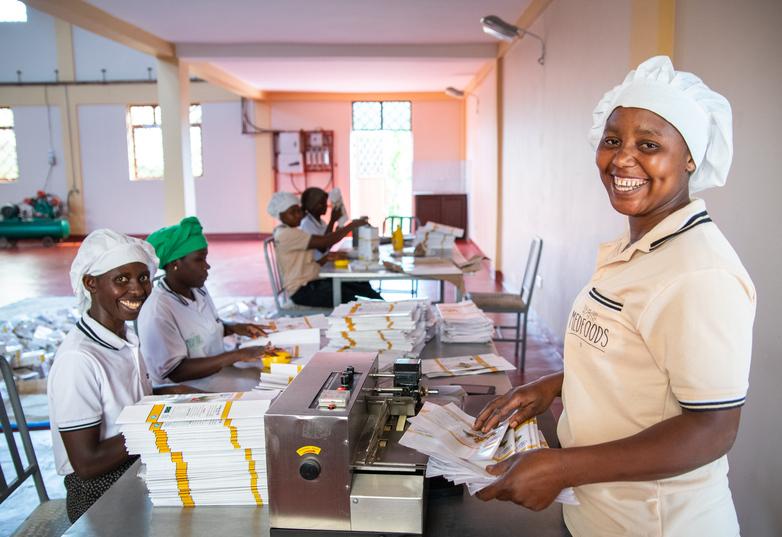 Women producing brochures.