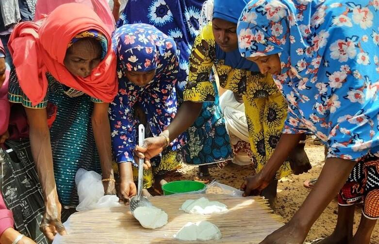 Women making goat cheese in Niger