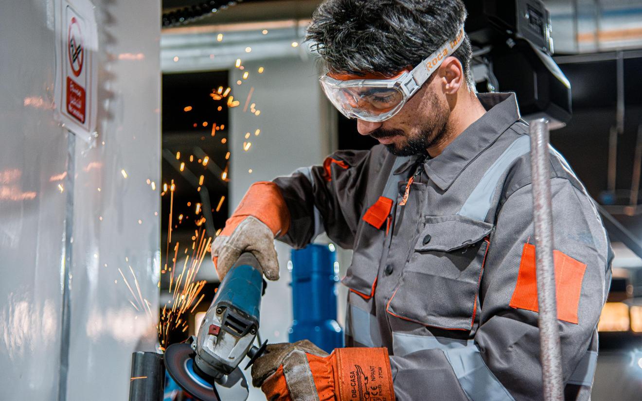 A man working with an angle grinder