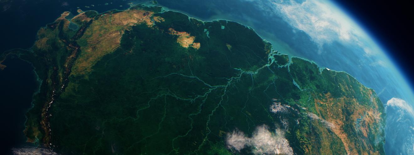 Satellite image of South America focusing on the Amazon Basin, characterized by dense rainforest and branching river systems.