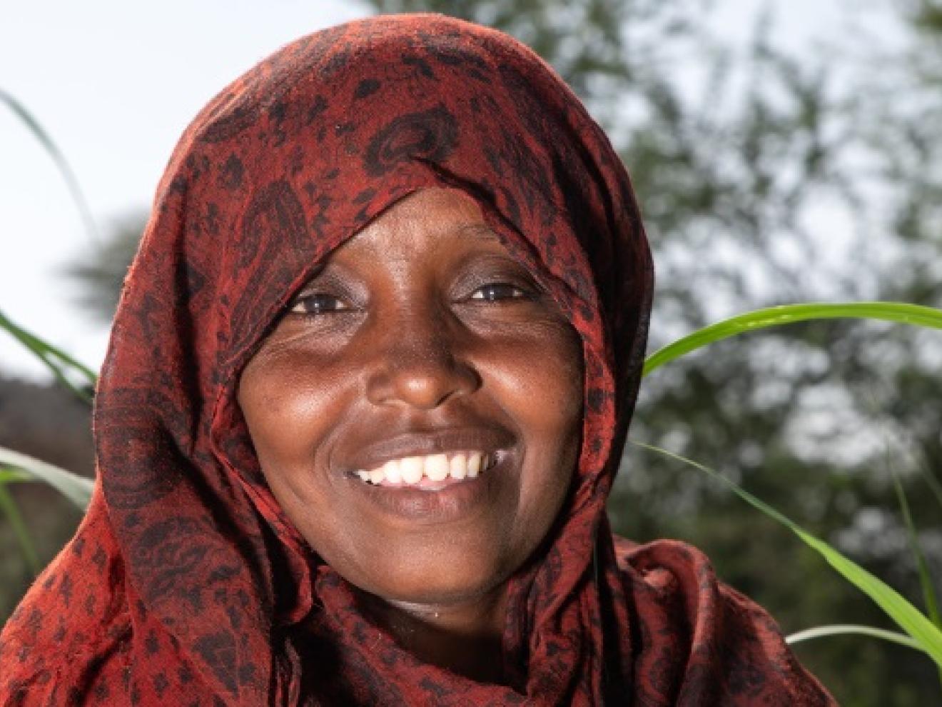 Woman in a maize field.