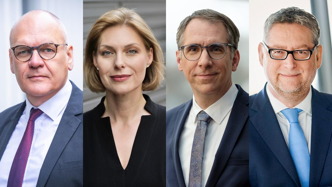 Vier Porträtfotos nebeneinander: drei Männer und eine Frau in Business-Kleidung, alle in die Kamera blickend.