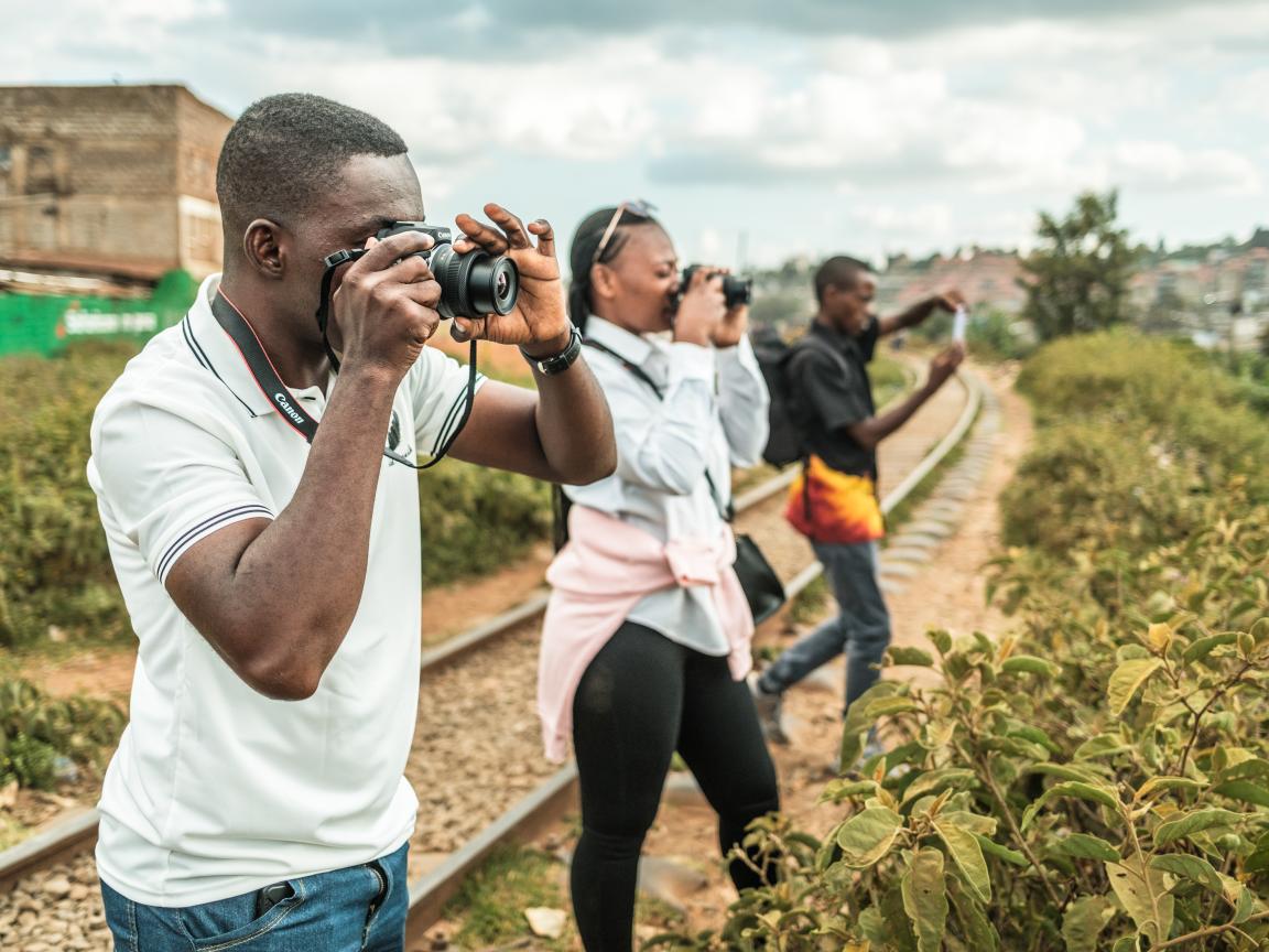 Emerging photographers capturing community experiences of resilience during the field assignment in Kibera, Nairobi 