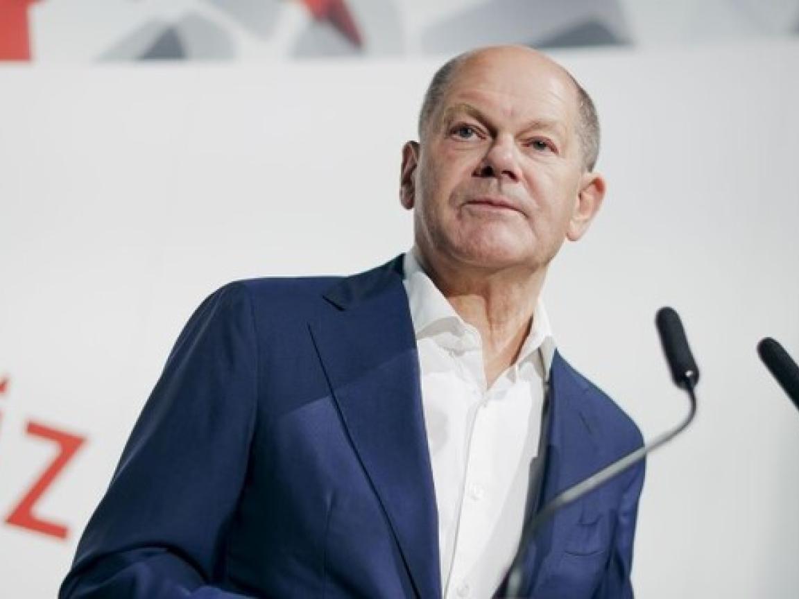 Bundeskanzler Scholz hält eine Rede beim Jahresempfang der GIZ