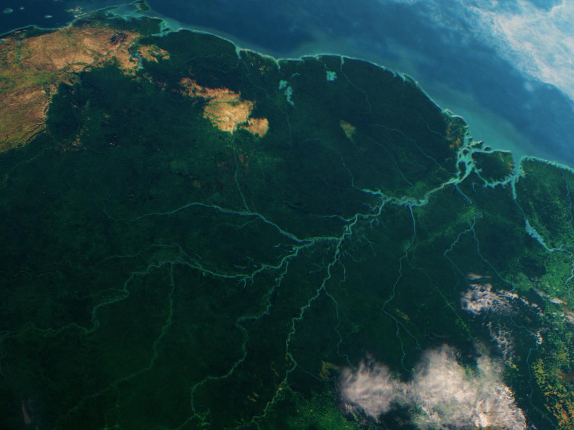 Satellite image of South America focusing on the Amazon Basin, characterized by dense rainforest and branching river systems.