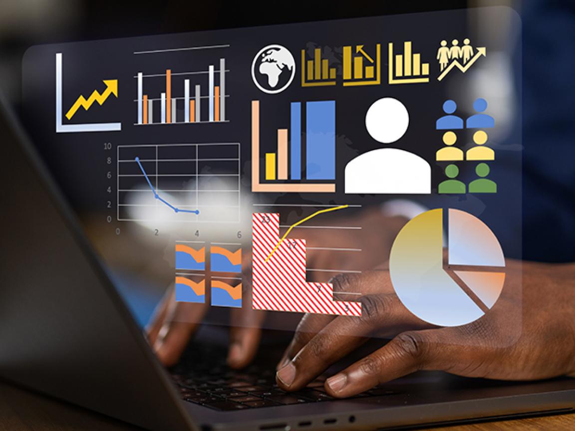 Close-up of a person in a suit using a laptop, overlaid with analytics visuals such as bar, line and pie charts plus user-group icons.