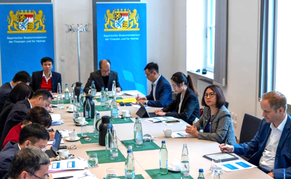 Group of people sitting at a big table