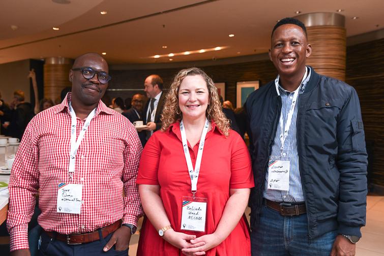 3 people smiling at the camera