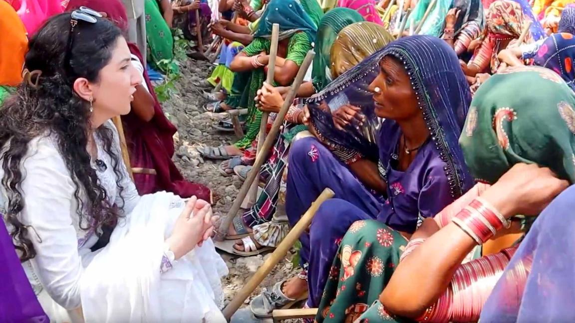 Woman listens to other Women