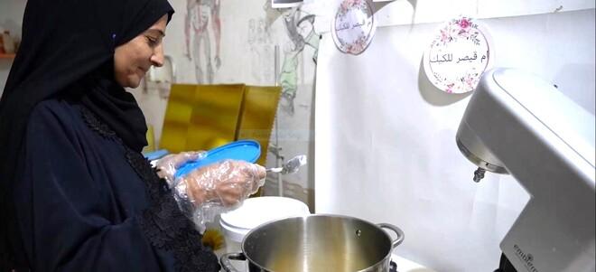 Enas, an anbari business owner in her bakery shop