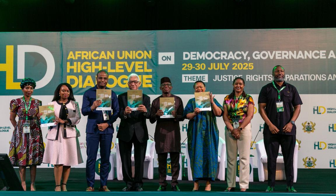 A group of people holding the African Governance Report 2025
