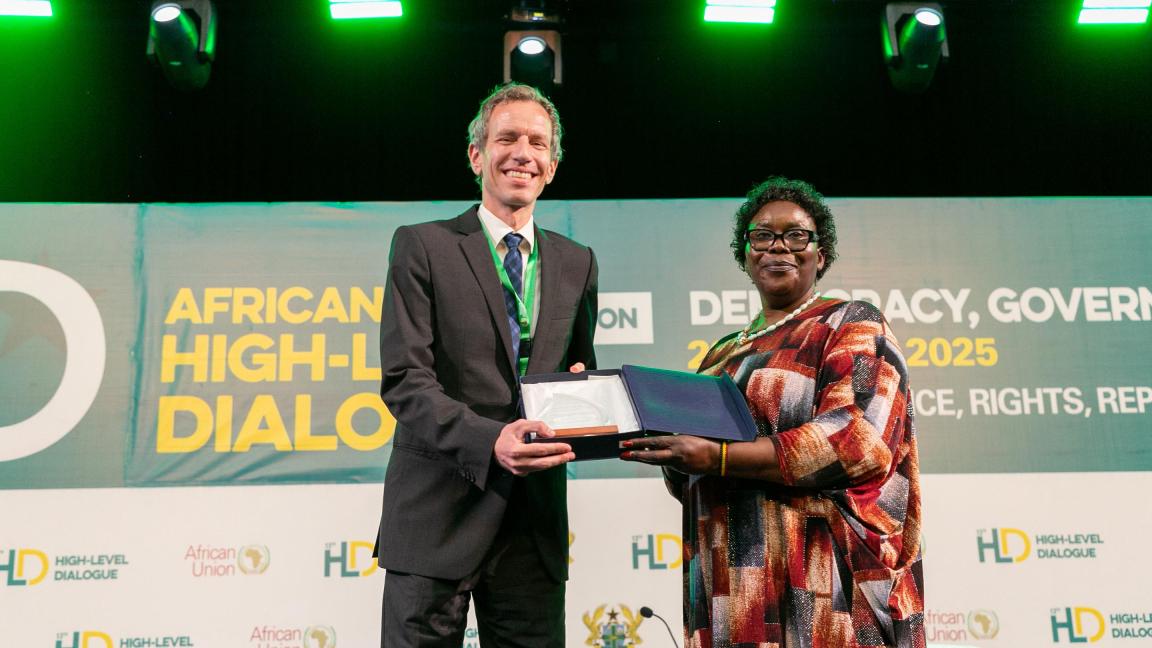 Ambassador Rebecca Amuge, Permanent Representative of Uganda to the AU and Chairperson of the AU Peace and Security Council for the month of July, presenting the recognition award to Mr. Max Middeke, Sector Coordinator for Conflict Prevention and Peacebuilding and Head of Programme for promoting Peace, Security and Governance in Africa at GIZ African Union