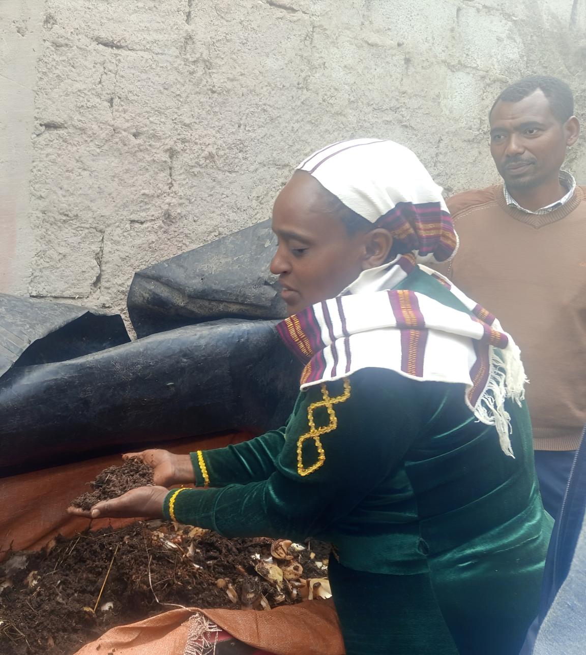 A woman and a man at a farming site