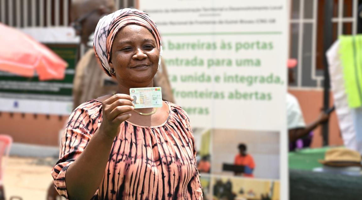 Woman receiving ECOWAS ID card