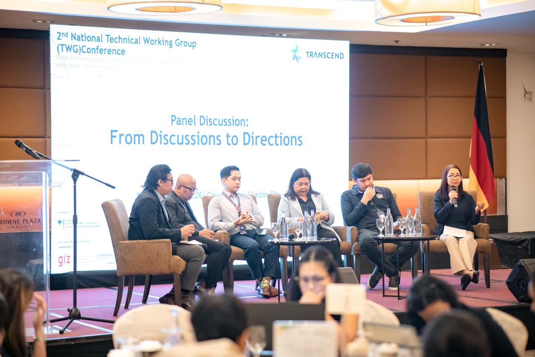 Representatives of the TWG discussing the highlights of the meetings