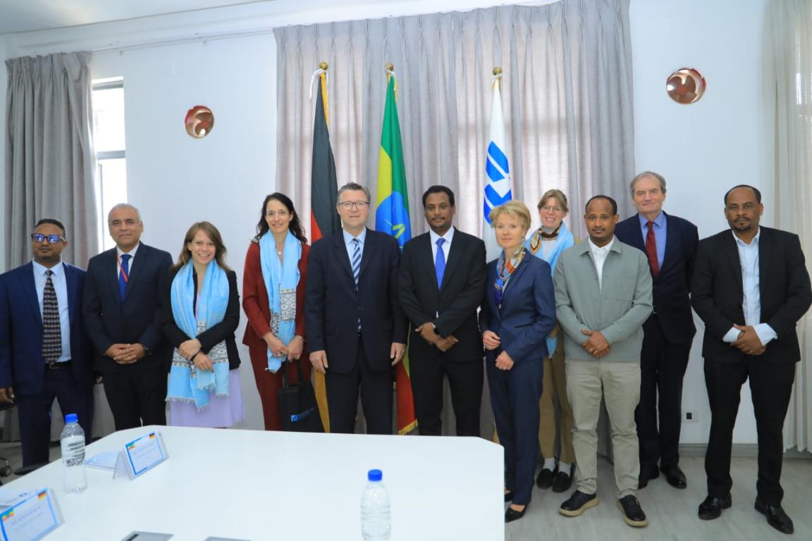 Members of the delegation posing for a group picture with members of the host institution 