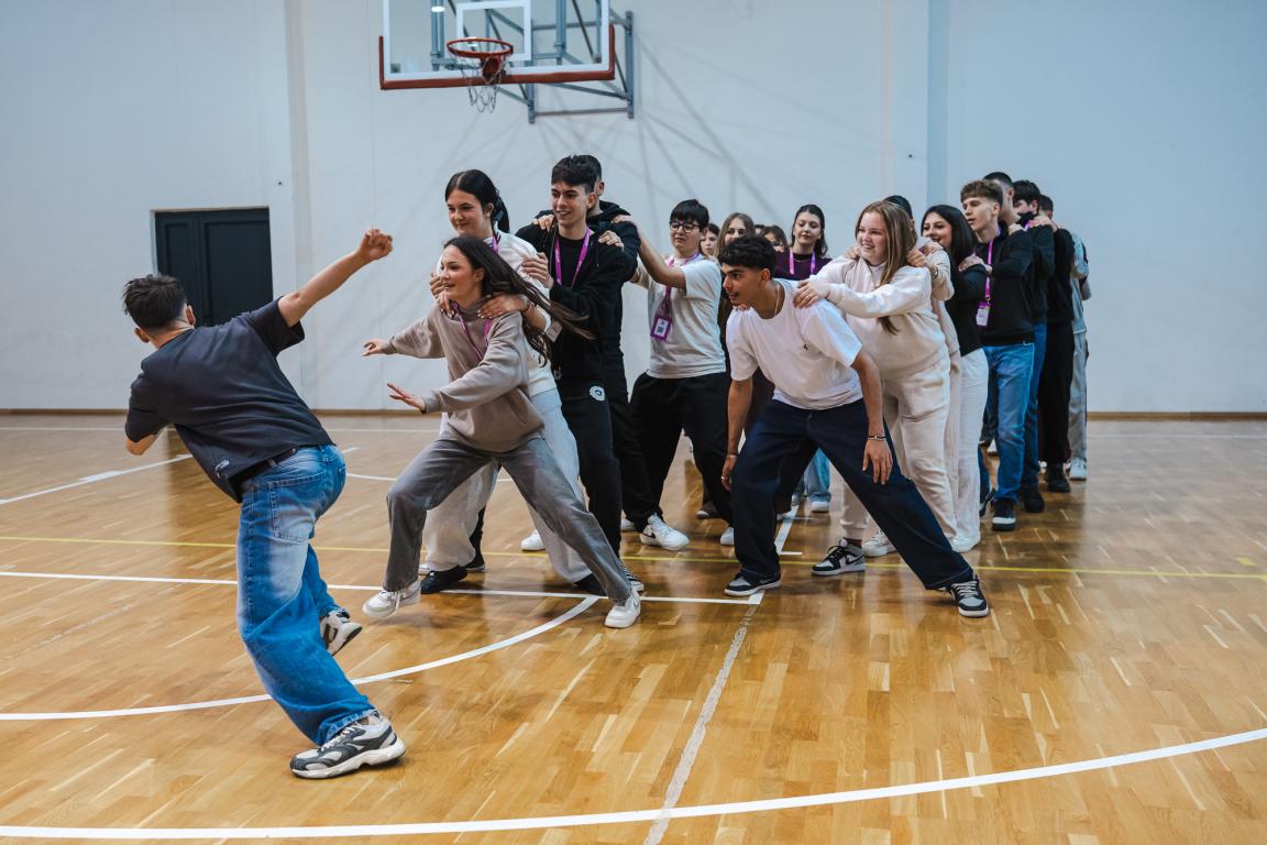 Young participants working together in a lively group activity during a Superschools exchange.