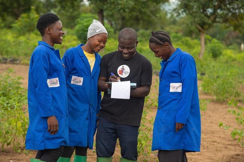 A tutor oversees three trainees in his agricultural enterprise