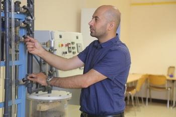 A man working at a machine.