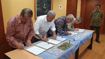 Men are signing documents