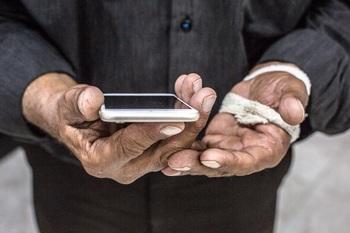 Two hands holding a smartphone.