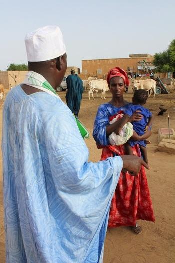 A community paralegal advises his client on her case