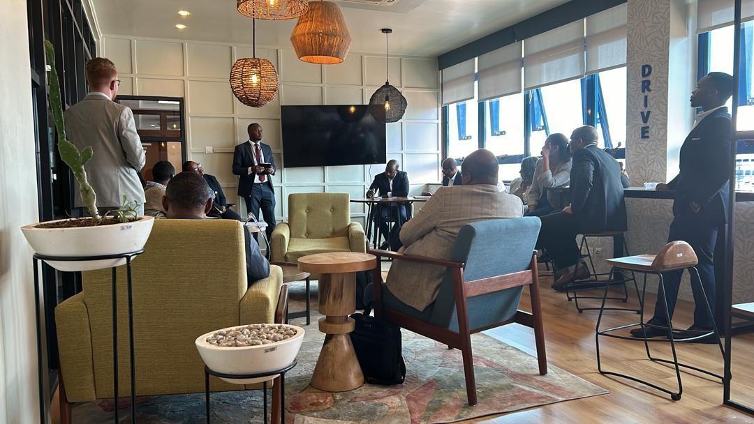 People sitting together in an office and engaging in discussion.