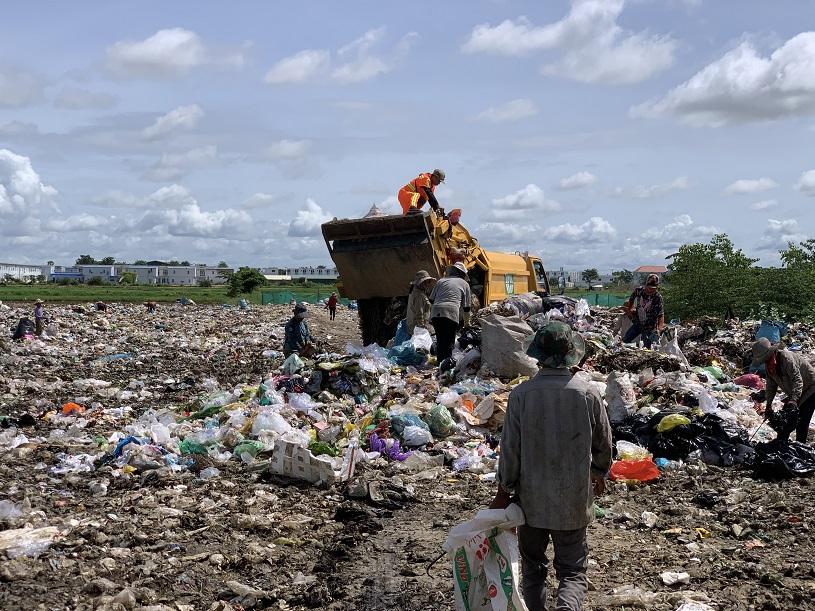 People on a landfill site.