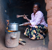 A woman cooking with an improved stoves provided through the Energizing Development Programme in Malawi. © GIZ