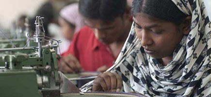 Women are working on sewing machines.