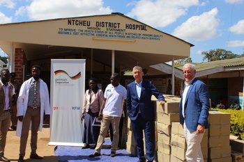 His excellency ambassador Jurgen Borsch (centre) and GIZ country director Alan Walsch (right) handing over Covid-19 materials to Ntcheu District Hospital Director Dr. Isaac Mbingwani (left)