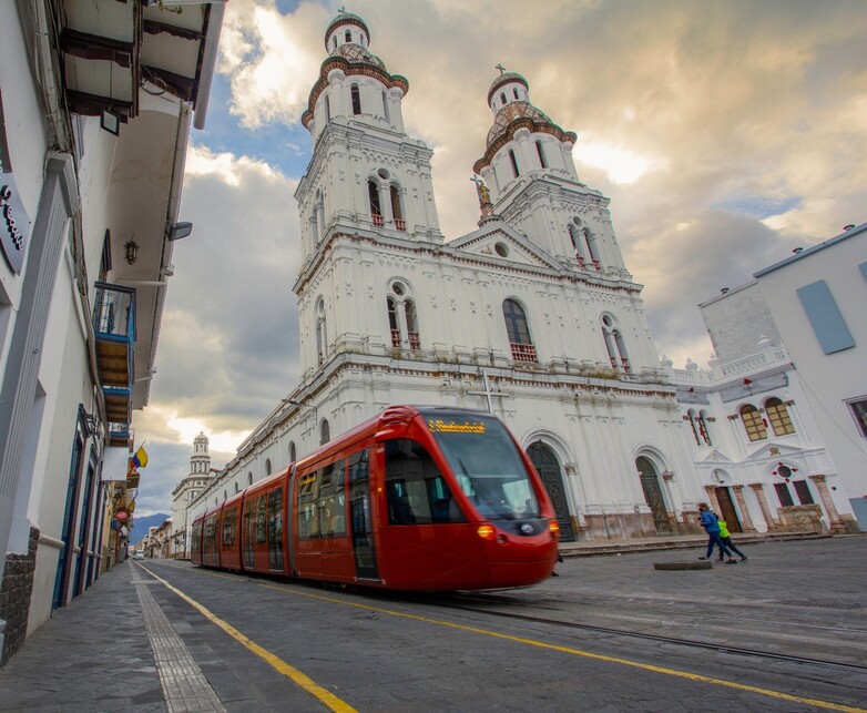 A tram travelling through a city.