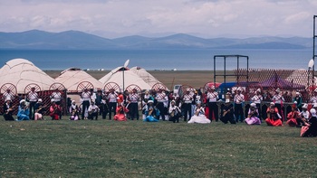 The folk music ensemble perform at the tourism festival.