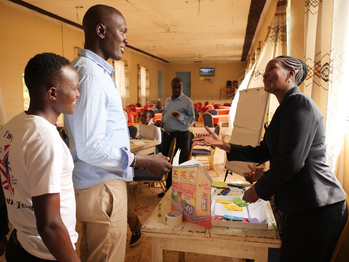 Young farmers from western Kenya learn about market dynamics in a game-based training course on supply and demand