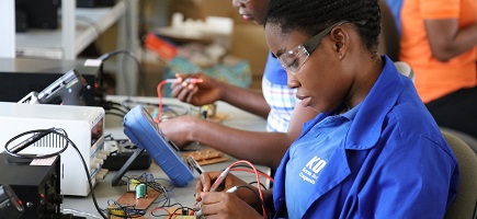 Two women are working with phase testers.