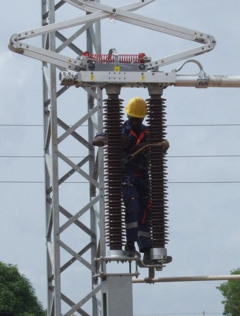 ©GIZ  Technician working at an electrical substation