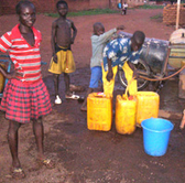 Burkina Faso. Providing drinking water. Children fill canisters at a public hydrant. © GIZ