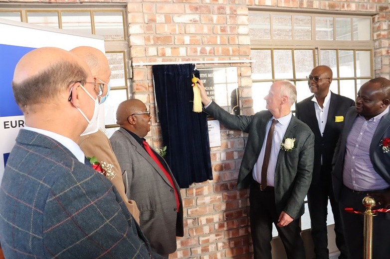 H.E Ambassador Herbert Beck unveiling the official plaque at Valombola VTC at the Inauguration of workshops