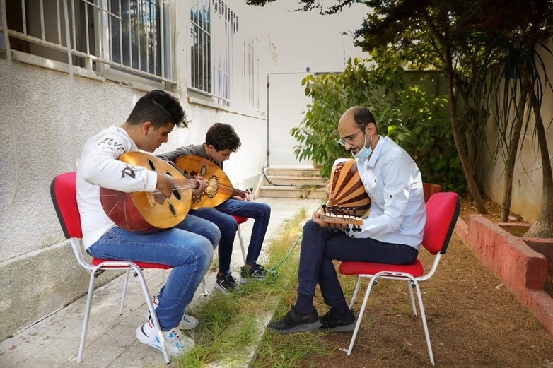 Boys taking music classes at Al Sununu, in the Gaza Strip. 